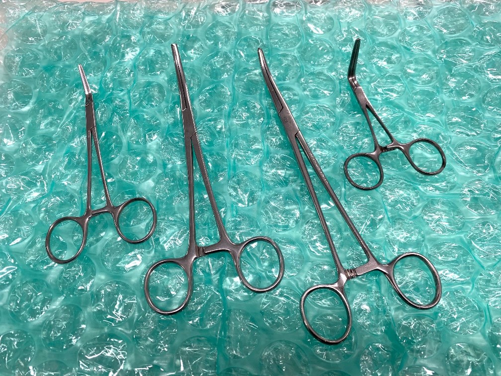 Lot of 4 - Curved Surgical Forceps