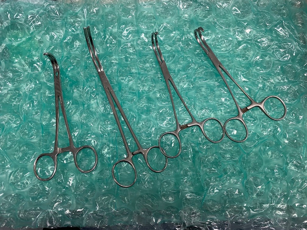Lot of 4 - Curved Forceps